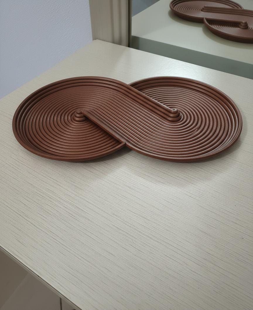 Svuotatasche Infinity color rame con finitura metallizzata e forma a infinito